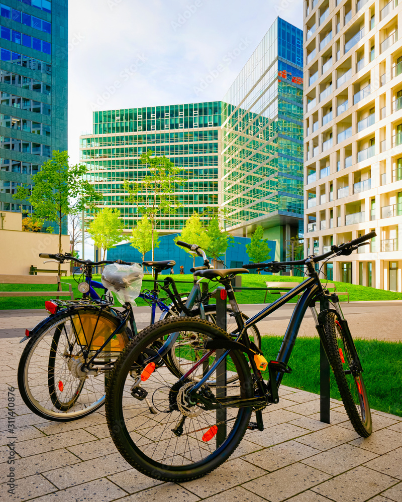 Fototapeta premium Bicycles parked at Modern apartment residential and flat building Vienna reflex