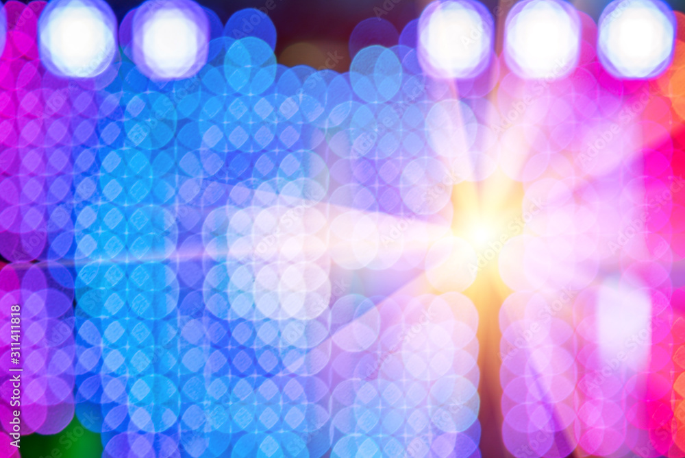 Beautiful abstract multicolored background with bokeh circles with blue circle and rays of light