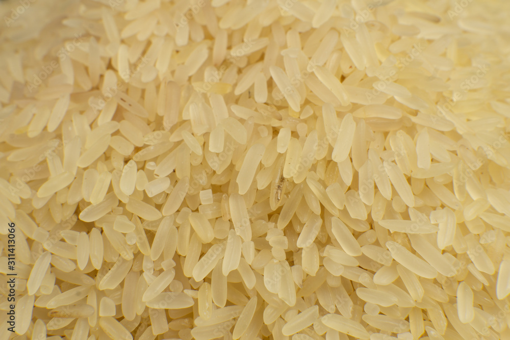 Long grain white rice background. Macro, closeup. Rice texture. Top view. Long grain white rice background. Macro, closeup. Rice texture. Top view.