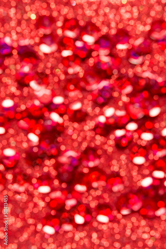 Abstract festive background .Christmas and New Year holidays glitter bokeh, glitter, bluer. Red color.