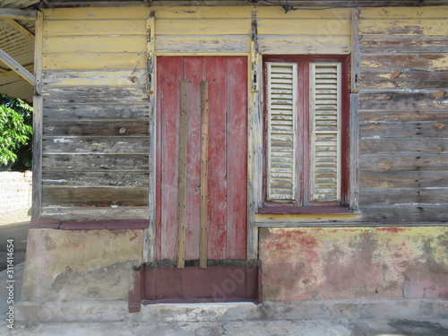 Typical colorful house in Martinique, French West Indies. Tropical multicolor windows. photo