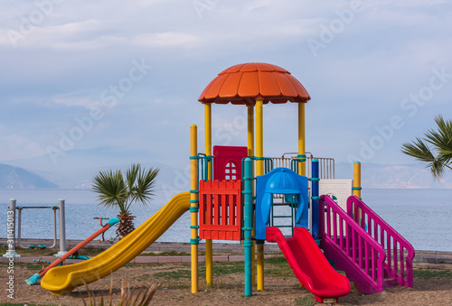 Wallpaper Mural Colorful playground for children. Playground with seascape in background. Torontodigital.ca