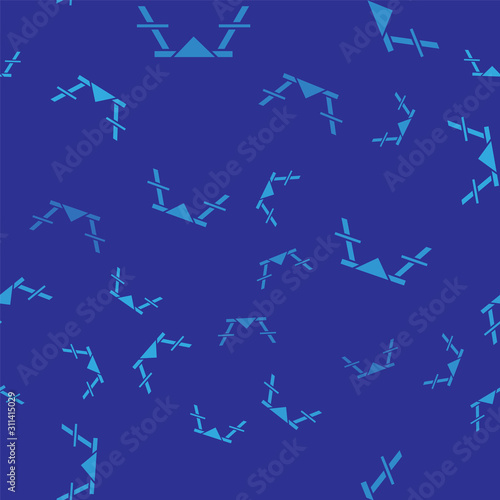 Blue Picnic table with benches on either side of the table icon isolated seamless pattern on blue background.  Vector Illustration
