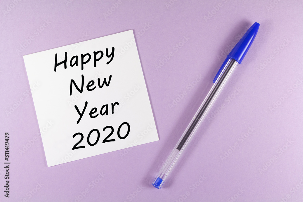 Pen and paper with happy new year 2020 Pen and paper with happy new year 2020