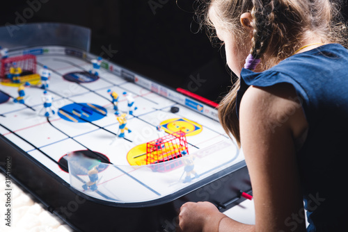 Boy playing on hockey at home, Children indoors game.