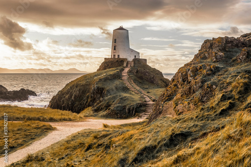 Tŵr Mawr lighthouse (meaning "great tower" in Welsh), on Ynys Llanddwyn on Anglesey, Wales, marks the western entrance to the Menai Strait.