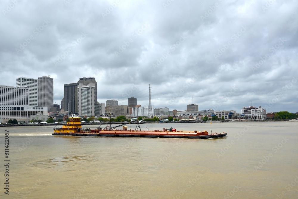 A river barge in front of the New Orleans skyline