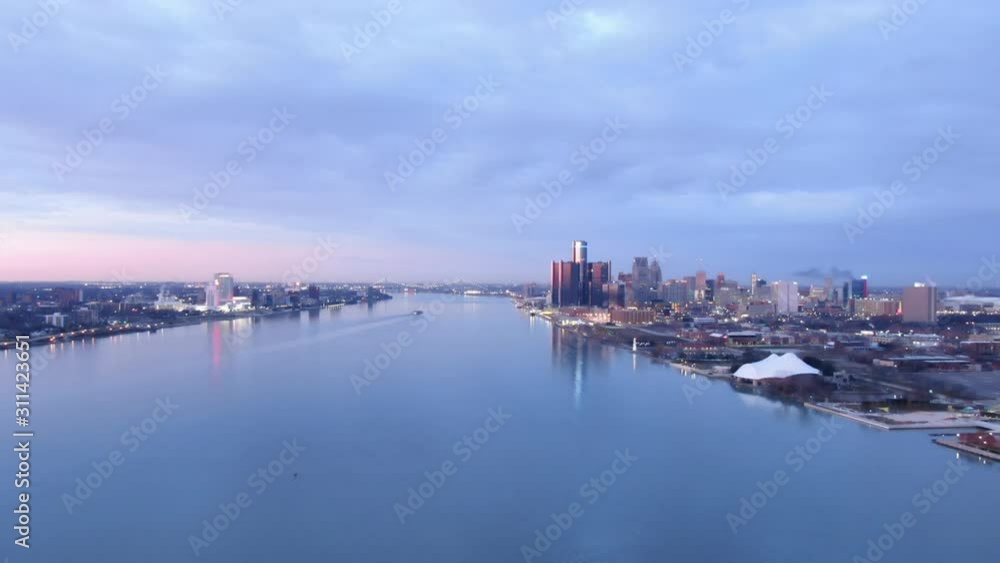 USA Michigan Detroit flying over Detroit River / Downtown Detroit / Windsor on a dark, cold, winter, morning at Sunrise USA Michigan Detroit flying over Detroit River / Downtown Detroit / Windsor on a dark, cold, winter, morning at Sunrise