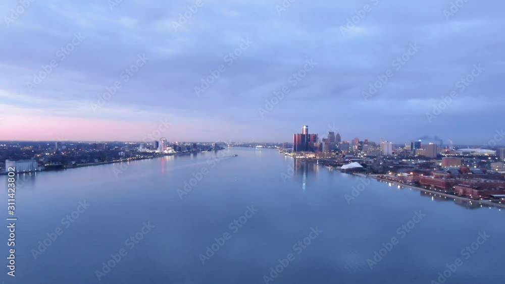 USA Michigan Detroit flying over Detroit River / Downtown Detroit / Windsor on a dark, cold, winter, morning at Sunrise USA Michigan Detroit flying over Detroit River / Downtown Detroit / Windsor on a dark, cold, winter, morning at Sunrise