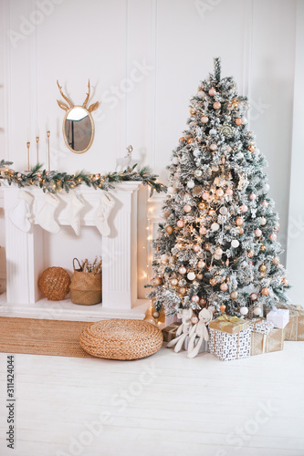 Christmas tree with gifts in the bright living room