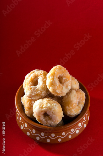 Indian Traditional Sweet Food Balushahi on a red background photo