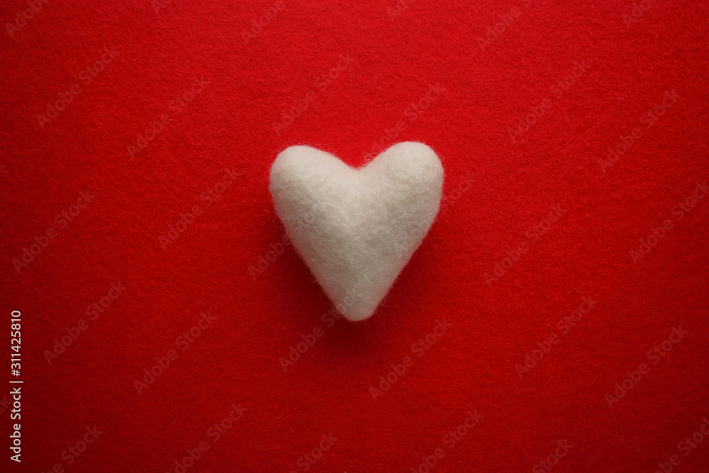 White heart on a red background. Valentine's day background. White heart on a red background. Valentine's day background.