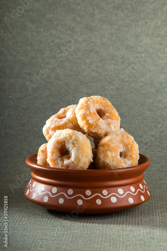 Indian Traditional Sweet Food Balushahi on a grey textured background photo