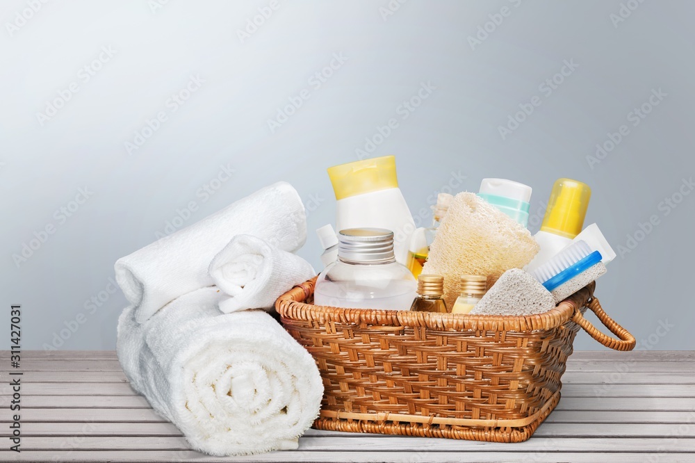 Bath towel and basket with accessories for on pastel background Bath towel and basket with accessories for on pastel background