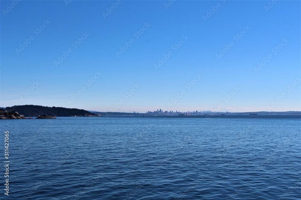 Vancouver Skyline from fairy on the sea to Vancouver Island. Beautiful landscape. View from boat