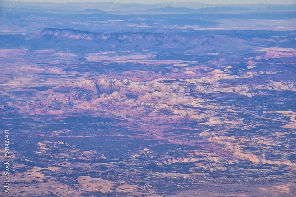Zions National Park in Utah, Aerial view from airplane of abstract Landscapes, peaks and canyons by Saint George, United States of America. USA.