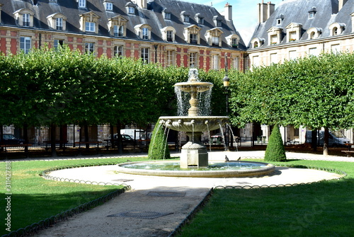 Fountain at Place des Vosges, the oldest square in the city. Paris. France.