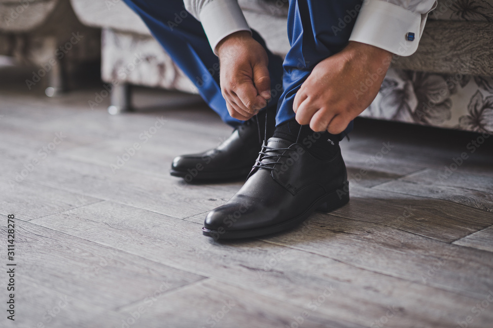 Hands lacing shoes before going out 2360. Hands lacing shoes before going out 2360.