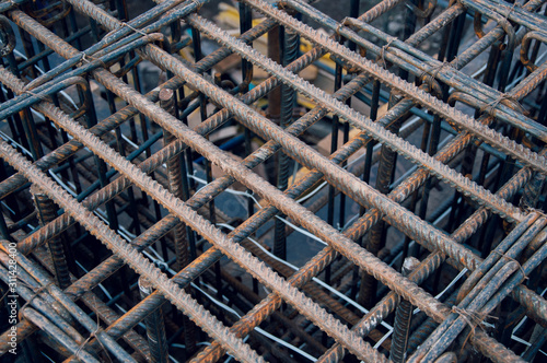 Rebar for the construction of a monolithic building. Steel base of the house. Stock rebar at construction site.