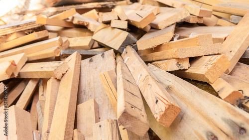 Pile of scrap wood from mattresses and palettes for recycled (up-cycled) DIY furniture making or wood carpentry projects. Wood cuts for practice or rustic craft ideas. Environmental resource saving.
