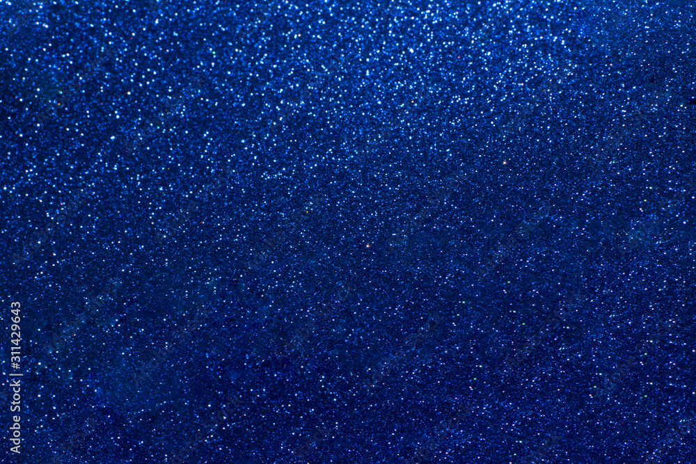 Blue glowing dynamic festive background shining sparkles bokeh. Glitter texture, holidays concept. Trend color 2020, layout for design. Trendy color concept of year, classic blue background. Blue glowing dynamic festive background shining sparkles bokeh. Glitter texture, holidays concept. Trend color 2020, layout for design. Trendy color concept of year, classic blue background.