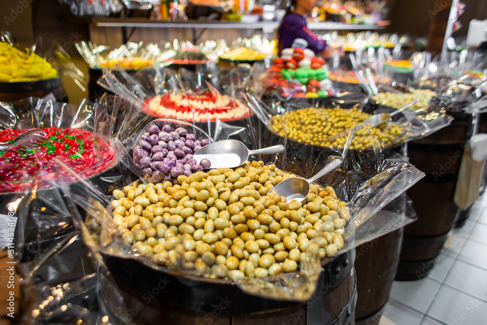 Confectionery shop in retro style. Colorful candies and sweets in wooden barrels.