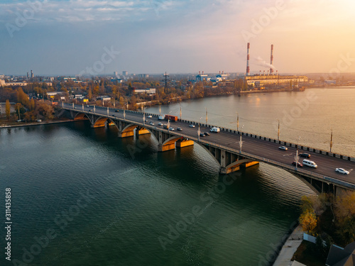 Evening autumn Voronezh. Sunset above Vogresovsky bridge over Voronezh river, aerial view