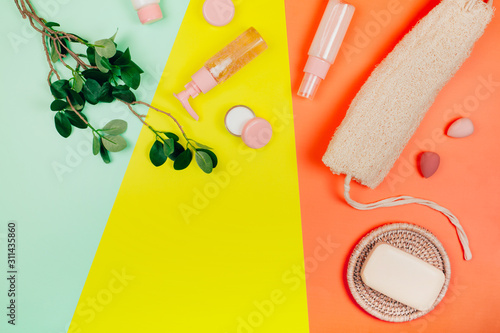 Care plastic-free cosmetics on pastel paper colorful background photo