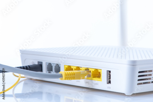 Foto Wireless router connected to network on white background