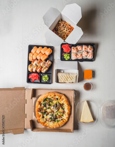 Set of delivery food. pizza sushi rolls wok