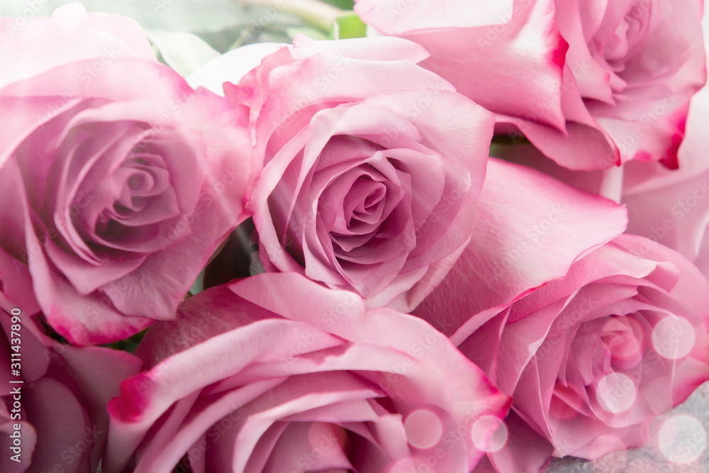 Flower arrangement - a bouquet of pink roses on table close up Flower arrangement - a bouquet of pink roses on table close up