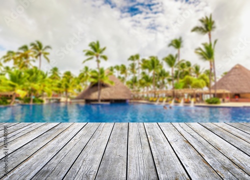 Pool to the Beach with Palms on background