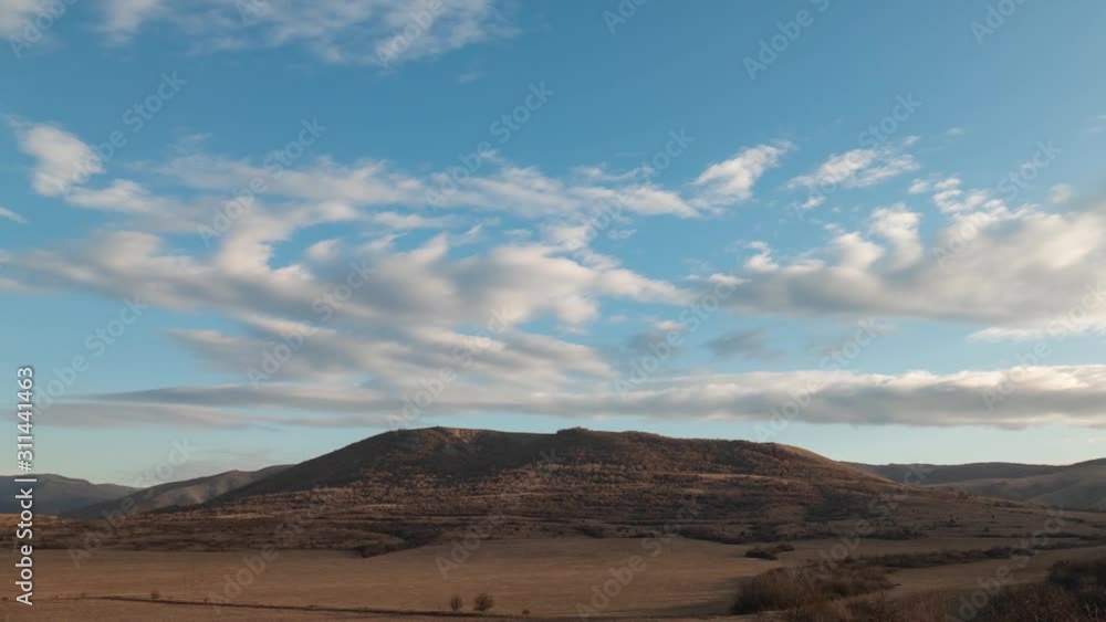 Plateau by the mountain. Clouds in blue sky over mountains, time lapse Plateau by the mountain. Clouds in blue sky over mountains, time lapse