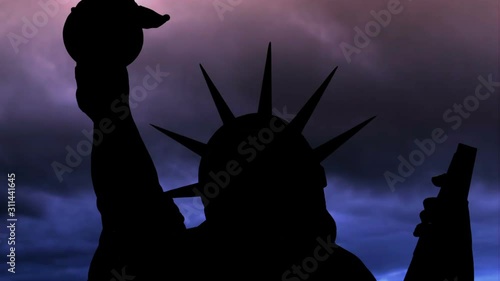 The Statue Of Liberty Of New York City Against Time Lapse Clouds