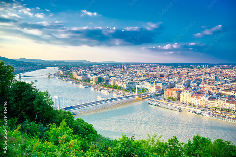 A view along the Danube River of Budapest, Hungary from Gellert Hill at sunset.