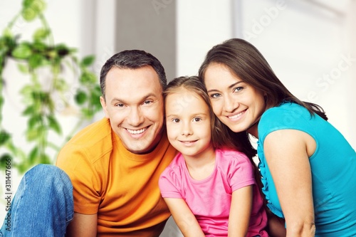 Beautiful smiling Lovely family siting on sofa