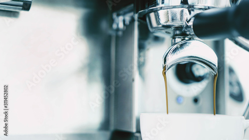 Barista attaching portafilter to the apparatus,Coffee Chill Concept