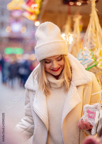 Beautiful blond girl in Christmas market i © Simonforstock