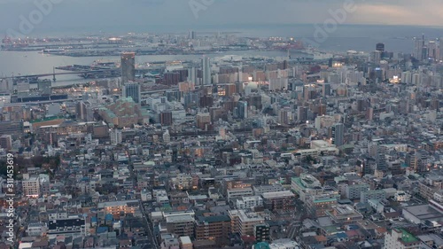 4k Pan over Kobe, Japan. Aerial View of City in early evening photo