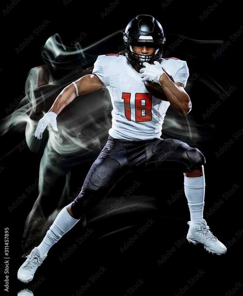 one african american football player man studio shot isolated on black background with light painting with blurred motion speed effect