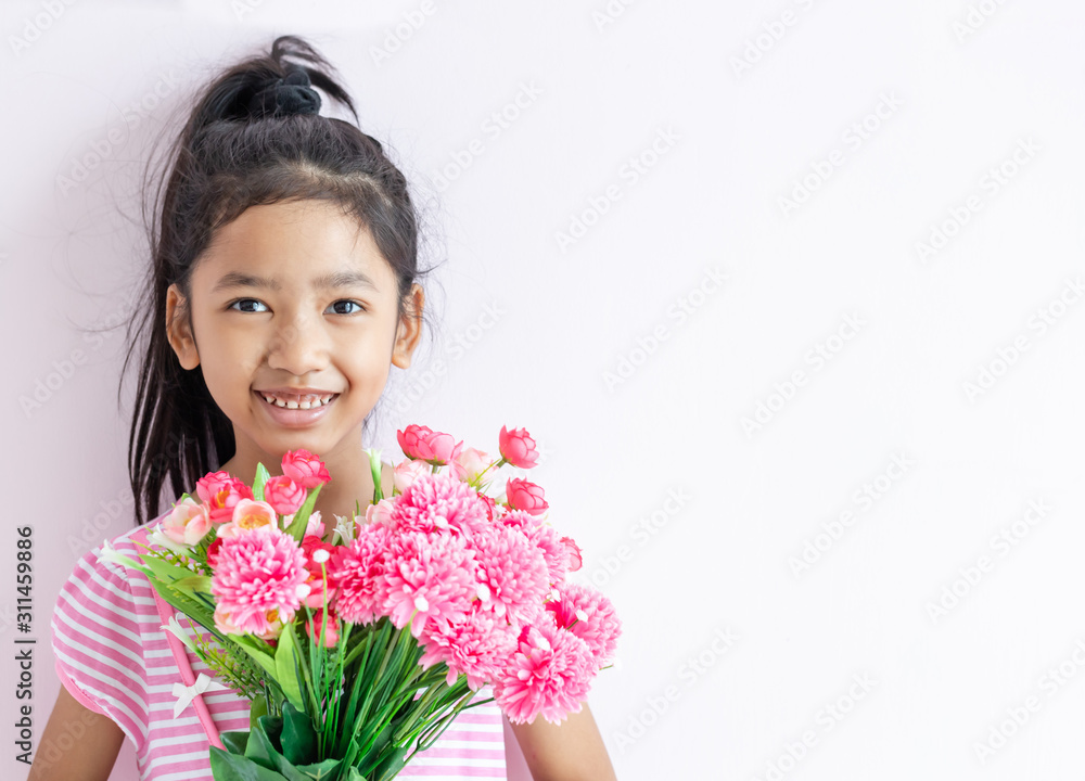 child holding bouquet flowers with smiling and happy. child holding bouquet flowers with smiling and happy.