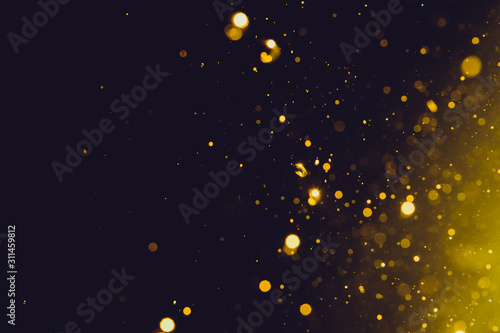 Abstract gold bokeh on black