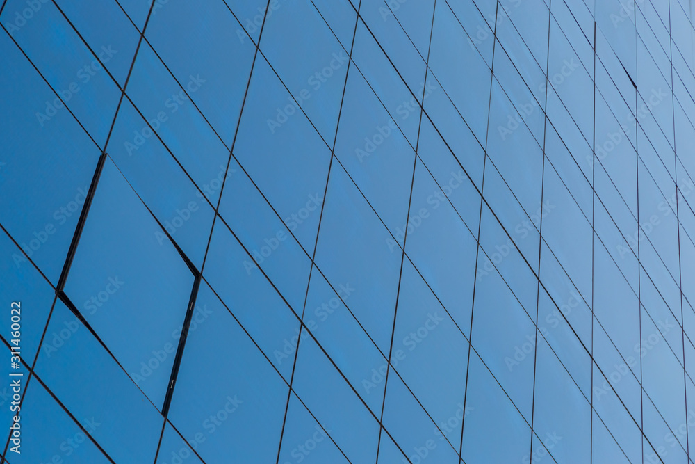 Blue glass windows of modern office building Blue glass windows of modern office building