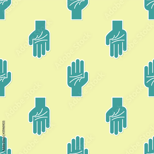 Green Palmistry of the hand icon isolated seamless pattern on yellow background.  Vector Illustration