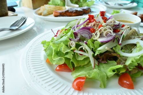 fresh salad on a white plate
