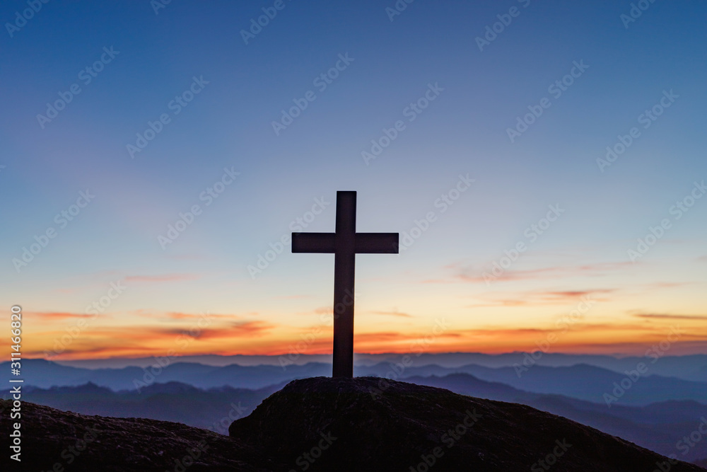 Silhouettes of crucifix symbol on the top of mountain layers line and colorful sky background.