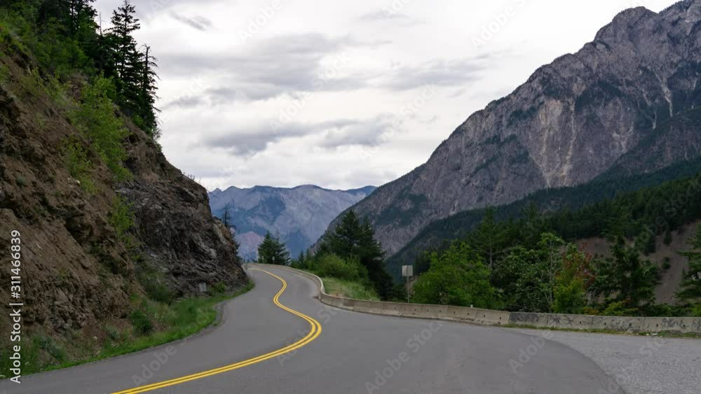 Time Lapse of Windy Road in the mountains of British Columbia. Taken on Duffey Lake Rd near Lillooet, during a cloudy early morning. Time Lapse of Windy Road in the mountains of British Columbia. Taken on Duffey Lake Rd near Lillooet, during a cloudy early morning.