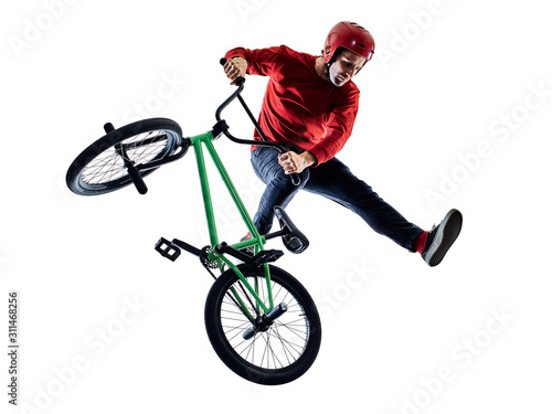 Fotografiet one young caucasian man BMX rider cyclist cycling freestyle acrobatic stunt in s