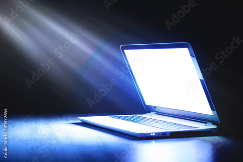 laptop on a wooden table