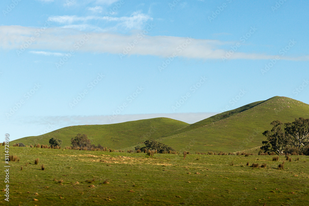Natural Landscape With Green Hills And Blue Sky Natural Landscape With Green Hills And Blue Sky